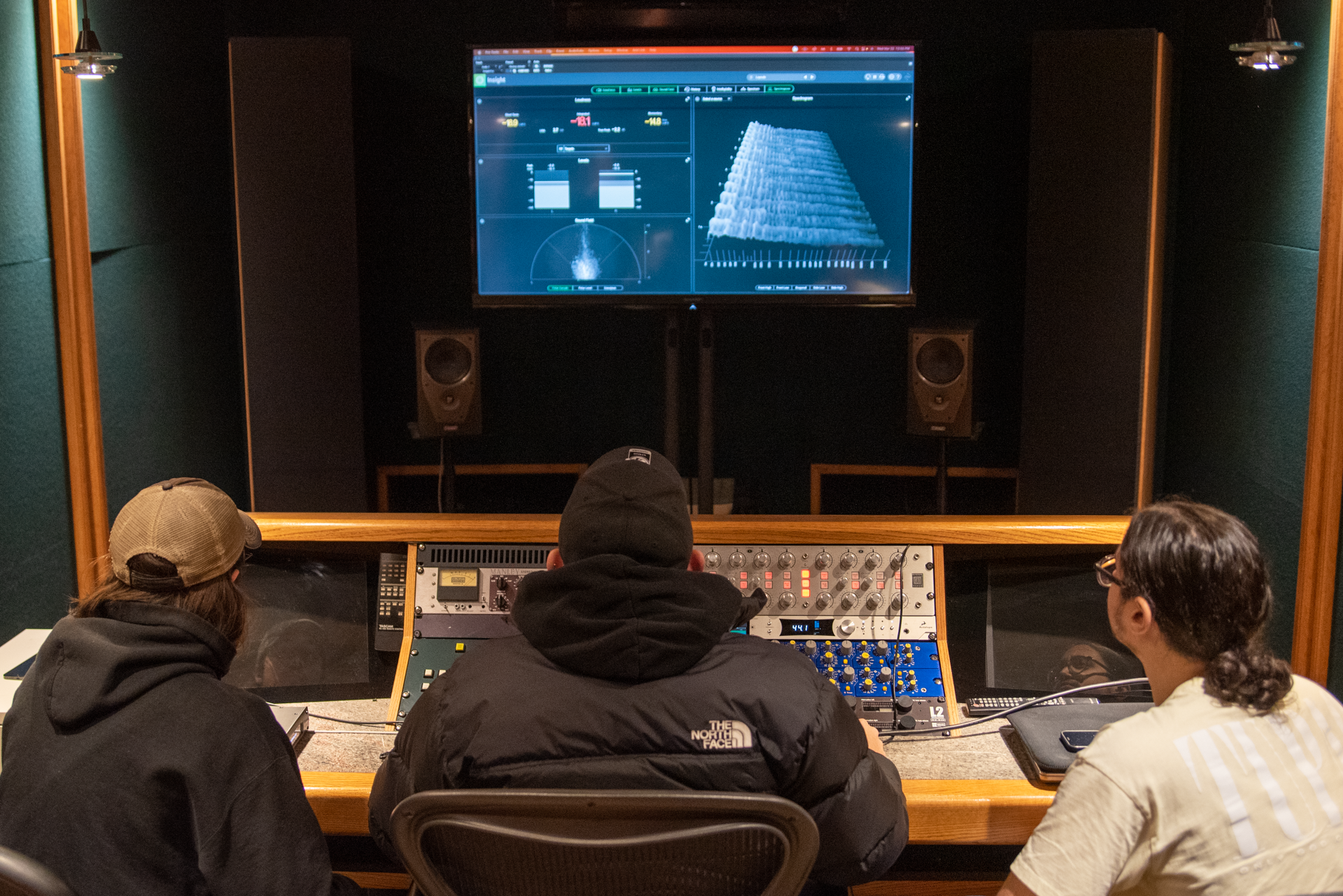 mixing and mastering students in the mastering studio